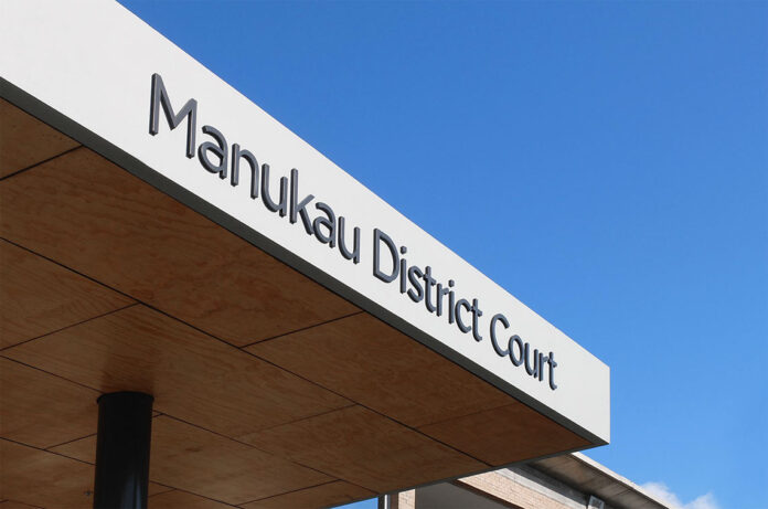 Exterior signage at the Manukau District Court building.