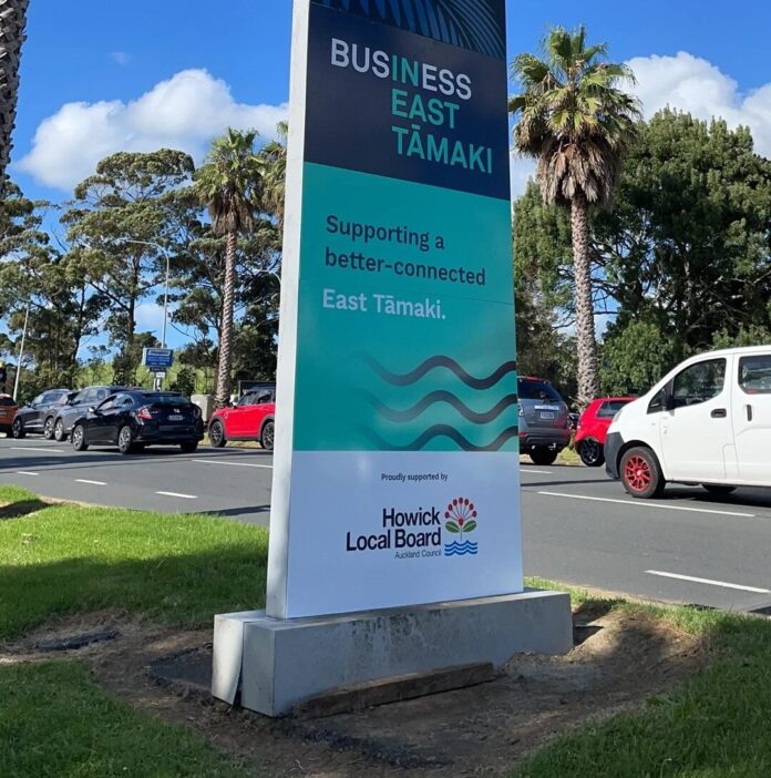 A Business East Tamaki sign beside the road on the approach to Highbrook