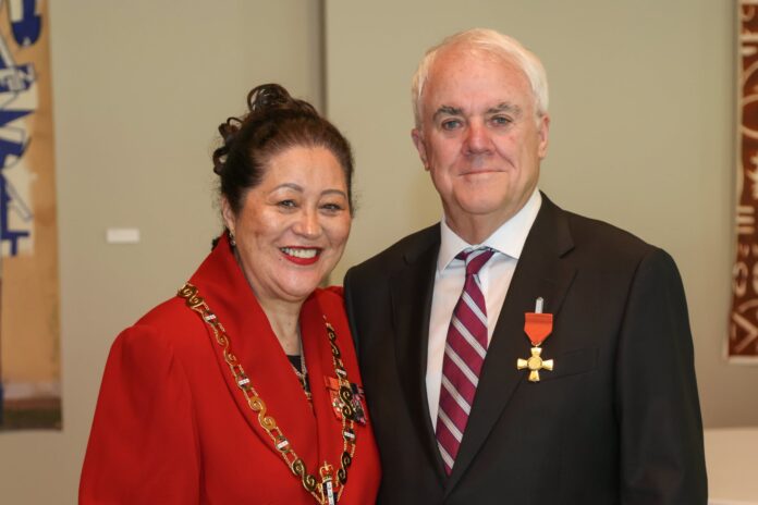 Evan Davies, wearing his ONZM insignia, stands beside Governor-General Dame Cindy Kiro.